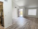 Open-concept living room featuring light-filled space, tile floors, and a view of the entry door at 629 N Mesa Dr # 29, Mesa, AZ 85201