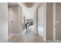 Bright hallway with tile flooring, leading to other rooms at 8 Biltmore Est # 123, Phoenix, AZ 85016