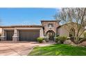 Elegant home with stone accents and a two-car garage at 9111 E Mountain Spring Rd, Scottsdale, AZ 85255