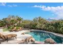 Inviting pool and spa with mountain backdrop at 9111 E Mountain Spring Rd, Scottsdale, AZ 85255