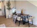 Dining area with four chairs and a modern table at 9408 E Supernova Dr, Mesa, AZ 85212