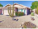 Cute one-story house with desert landscaping and a two-car garage at 10728 W Irma Ln, Sun City, AZ 85373