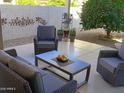 Relaxing patio with wicker furniture and a coffee table at 10728 W Irma Ln, Sun City, AZ 85373