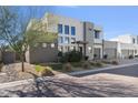 Modern home's exterior, showcasing clean lines and desert landscaping at 10929 E North Ln, Scottsdale, AZ 85259