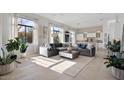 Open concept living area with large windows and modern furniture at 10929 E North Ln, Scottsdale, AZ 85259