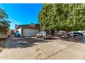 House with attached two car garage and mature shade tree in front at 11840 N 49Th Ave, Glendale, AZ 85304
