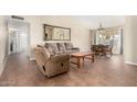 Spacious living room with tile floors and a dining area at 1243 E Avenida Grande --, Casa Grande, AZ 85122