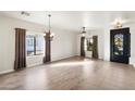 Bright dining room with hardwood floors and chandelier at 1427 E Saddlebrook Ct, Casa Grande, AZ 85122