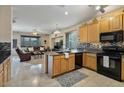 Kitchen features granite countertops and oak cabinets at 17639 W Buckhorn Dr, Goodyear, AZ 85338