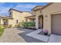 Front view of a two-story house with a two-car garage and walkway at 18749 W San Miguel Ave, Litchfield Park, AZ 85340