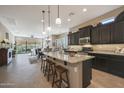 Island kitchen with granite countertops and stainless steel appliances at 2026 N Atwood --, Mesa, AZ 85207