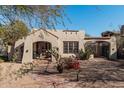 Spanish-style home with a front yard, walkway, and mature landscaping at 2515 N 10Th St, Phoenix, AZ 85006