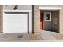 White garage door and walkway to the front door of the home at 2830 W Eagle Talon Rd, Phoenix, AZ 85085
