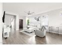 Light-filled living room with hardwood floors and comfortable seating at 41633 N Cedar Chase E Rd, Anthem, AZ 85086