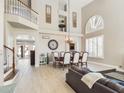 Elegant dining room with high ceilings, chandelier, and hardwood floors at 4530 W Misty Willow Ln, Glendale, AZ 85310