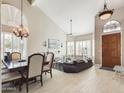 Bright living room with hardwood floors and large windows at 4530 W Misty Willow Ln, Glendale, AZ 85310