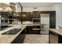 Modern kitchen with stainless steel appliances and granite countertops at 15215 N Kierland Blvd # 632, Scottsdale, AZ 85254