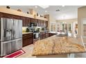 Kitchen with stainless steel appliances and granite countertops at 15225 W Via Manana Dr, Sun City West, AZ 85375