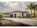 Spacious three-car garage with paver driveway at 18145 W Rancho Dr, Litchfield Park, AZ 85340