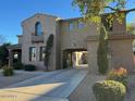 Two-story house with arched entryway and porte-cochère at 20391 E Via Del Oro Dr, Queen Creek, AZ 85142