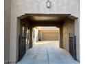 Covered entry to two-car garage with gated access at 20391 E Via Del Oro Dr, Queen Creek, AZ 85142