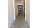 Bright hallway with tile flooring leading to other rooms at 20496 W Valley View Dr, Buckeye, AZ 85396