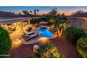 Inviting backyard oasis featuring a sparkling pool and patio area at 22012 N Arrellaga Dr, Sun City West, AZ 85375