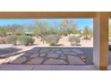 Stone patio with desert landscaping, providing a relaxing outdoor space at 2490 E Fiesta Dr, Casa Grande, AZ 85194