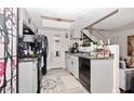 Modern kitchen with gray cabinets and black appliances at 2697 W Ocotillo Rd, Phoenix, AZ 85017