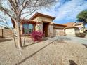 Front yard view of a one-story house with desert landscaping at 2706 N 115Th Dr, Avondale, AZ 85392