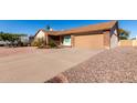 Brick house with a two-car garage and a long driveway at 2728 E Encanto Cir, Mesa, AZ 85213