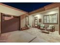 Inviting courtyard with tiled flooring, seating area, and potted plants at 29512 N Tarragona Dr, Peoria, AZ 85383