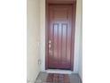 Modern brown front door with a welcome mat at 3094 N 195Th Dr, Buckeye, AZ 85396