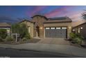 Stunning two-story home with brick accents and a solar panel system at 316 E Leverenz Ave, Queen Creek, AZ 85140