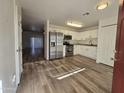 Bright kitchen with stainless steel appliances and wood-look flooring at 3408 W Mclellan Blvd, Phoenix, AZ 85017