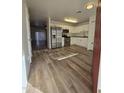 Bright kitchen with stainless steel appliances and wood-look flooring at 3408 W Mclellan Blvd, Phoenix, AZ 85017