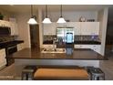 Eat-in kitchen with stainless steel appliances and granite countertops at 3432 E Bartlett Dr, Gilbert, AZ 85234