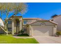 Two-story house with a large front yard and attached garage at 3947 N Carnation Ln, Avondale, AZ 85392