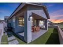 Covered patio with outdoor dining furniture and a built-in grill at 4802 S Duffy --, Mesa, AZ 85212