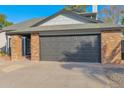 Attached two-car garage with a dark-colored door at 5344 W Desert Hills Dr, Glendale, AZ 85304