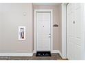 Bright entryway with a white door and a welcome mat at 5350 E Deer Valley Dr # 1418, Phoenix, AZ 85054