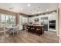 Spacious kitchen featuring island, stainless steel appliances, and hardwood floors at 5429 E Barwick Dr, Cave Creek, AZ 85331