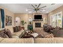 Bright living room with stone fireplace and comfortable seating area at 5429 E Barwick Dr, Cave Creek, AZ 85331