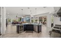 Island kitchen with breakfast bar and view into living room at 6033 E Pebbles Ct, Cave Creek, AZ 85331