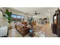 Spacious living room featuring leather furniture and open floor plan at 6033 E Pebbles Ct, Cave Creek, AZ 85331