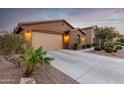 Two-story home with attached garage and well-maintained landscaping at 631 W Stanley Ave, San Tan Valley, AZ 85140