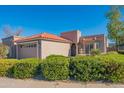 Spanish style home with tile roof, landscaped yard, and two-car garage at 6425 N 79Th St, Scottsdale, AZ 85250