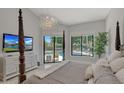 Spacious main bedroom with pool view and luxurious furnishings at 7347 E Turquoise Ave, Scottsdale, AZ 85258