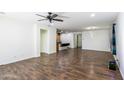 Spacious living room with hardwood floors and a ceiling fan at 7917 W Sierra Vista Dr, Glendale, AZ 85303