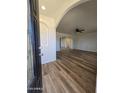 Bright entryway with wood-look floors and an arched hallway at 813 S Doran Cir, Mesa, AZ 85204